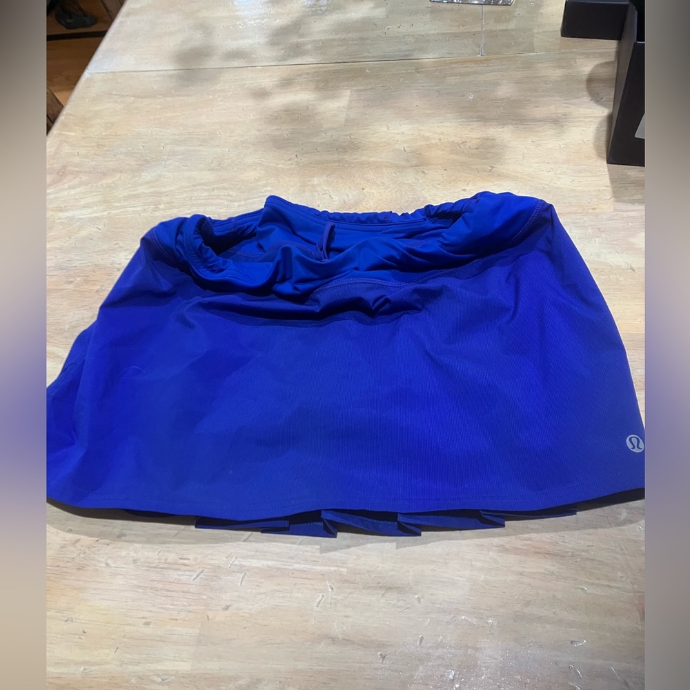 Sport skirt.Underneath attached shorts. Back is pleated. Vibrant bright blue.